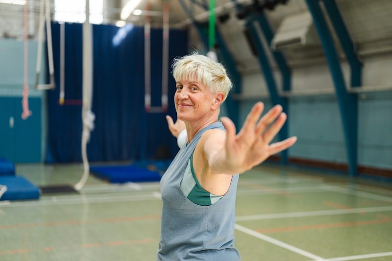 Older woman doing strength training in a gym