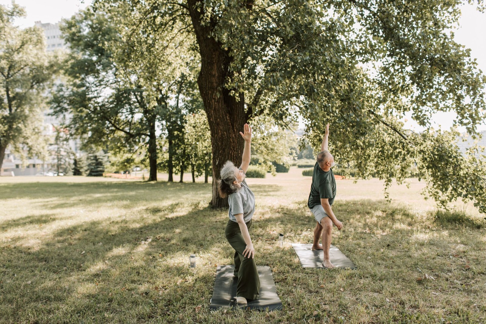 Older woman doing a balance exercise outdoors