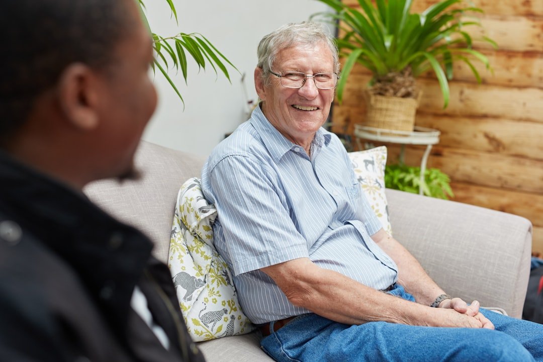 Two older men having a casual conversation outdoors