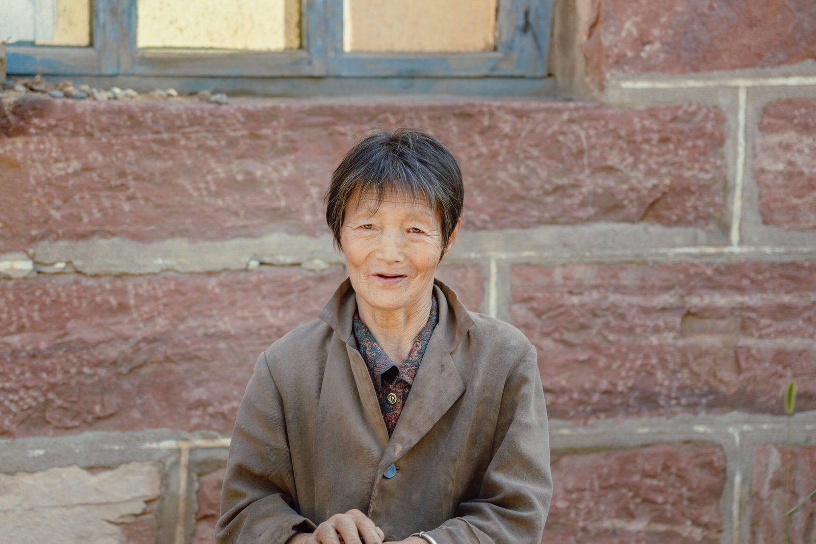 Charming portrait of a smiling elderly Asian woman, an example of aging with confidence