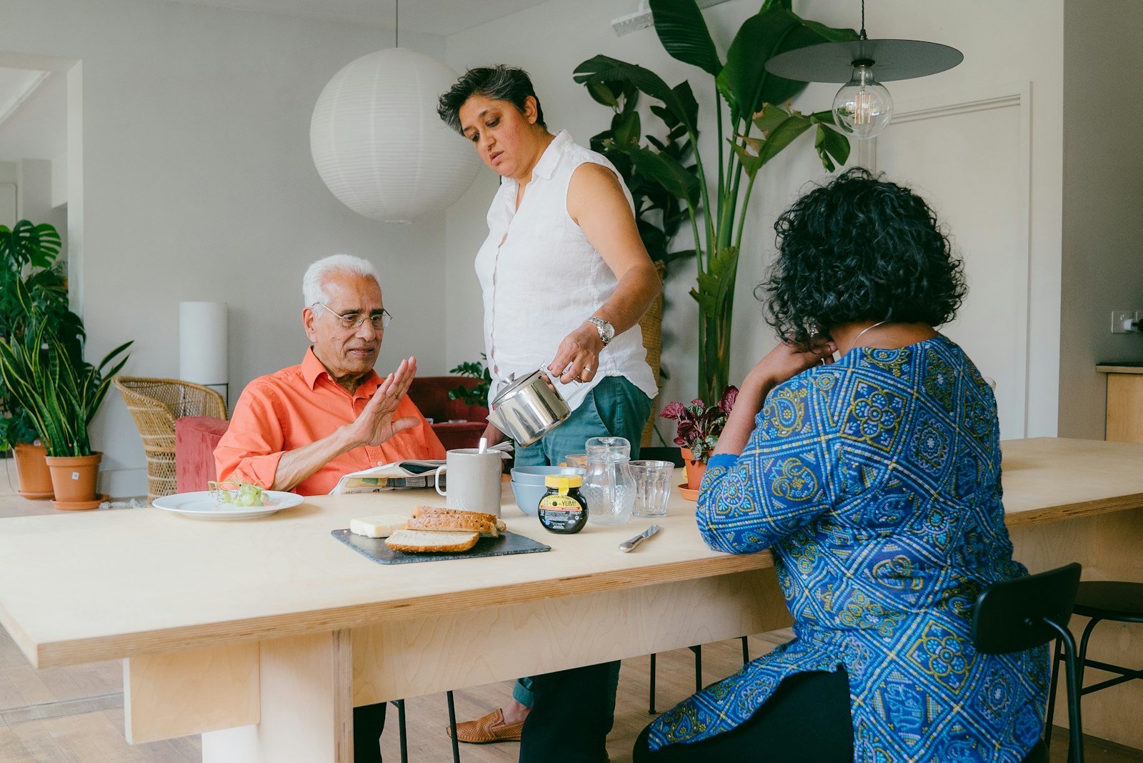 A family sharing a home-cooked meal around the kitchen table